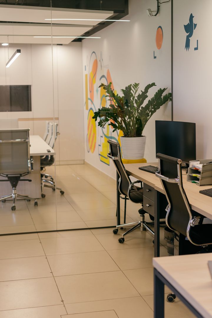 Bright modern open-plan office with glass partitions, freshly cleaned